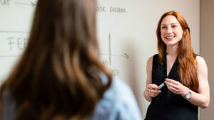 Female holding presentation for a colleague