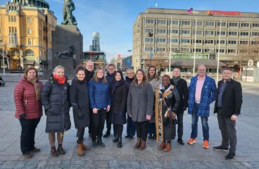 A group photo of some of the organizers gathered at Vaasa square.