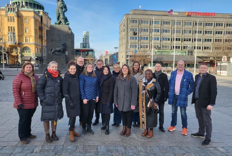 A group photo of some of the organizers gathered at Vaasa square.